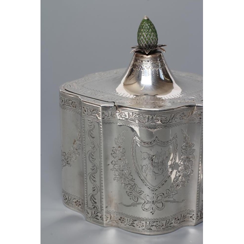 311 - A GEORGE III SILVER TEA CADDY, maker Henry Chawner, London 1788, of serpentine form, the flat hinged... 