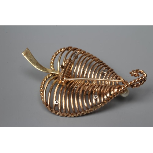 434 - A STYLISED OPEN LEAF BROOCH, the dished wire work panel with rope twist border centrally peg set wit... 