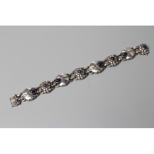 439 - A BRACELET to match the previous lot, collet set with cabochon polished blue hardstones, stamped and... 