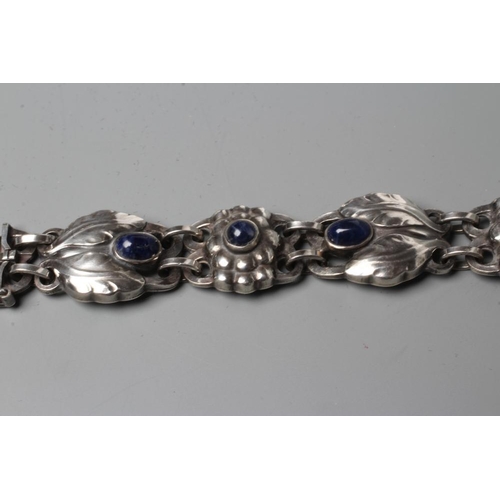 439 - A BRACELET to match the previous lot, collet set with cabochon polished blue hardstones, stamped and... 