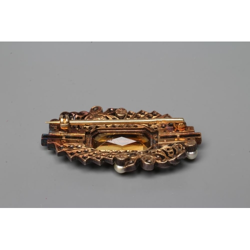 451 - AN ART DECO BROOCH, the central facet cut tourmaline(?) open back collet set and flanked by a row of... 