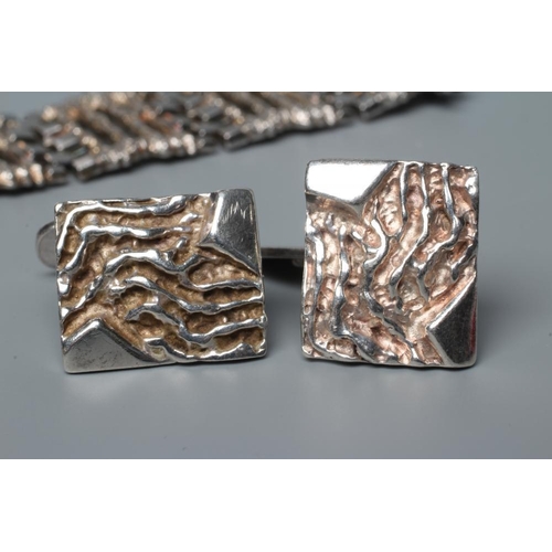 488 - A SILVER BRACELET, Birmingham 1970, (import), the eleven cast and pierced abstract panels with brick... 