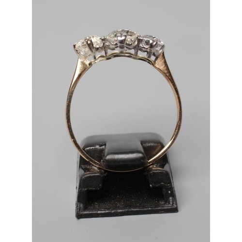 508 - A THREE STONE DIAMOND RING, the old cut stones totalling approximately 1ct, claw set to a plain unma... 