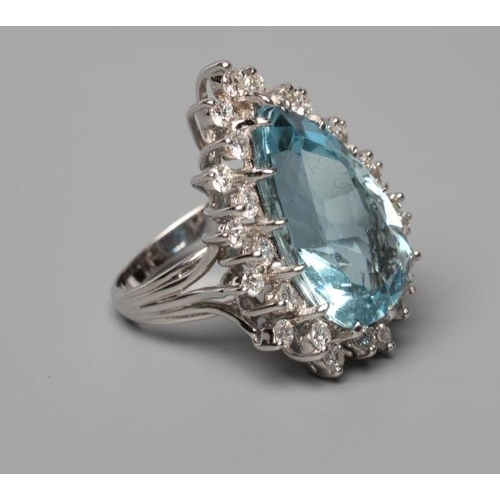 535 - AN AQUAMARINE AND DIAMOND COCKTAIL RING, the pear cut aquamarine of approximately 12.50cts, claw set... 