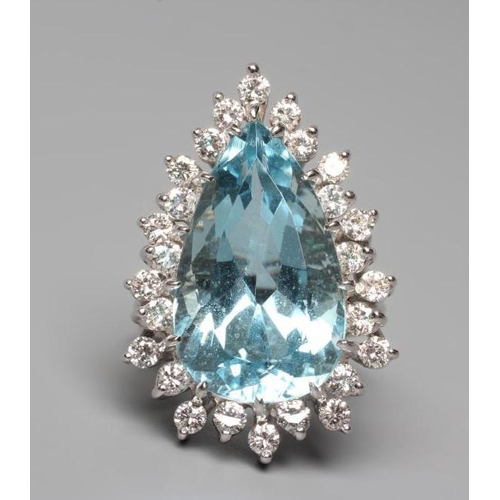 535 - AN AQUAMARINE AND DIAMOND COCKTAIL RING, the pear cut aquamarine of approximately 12.50cts, claw set... 