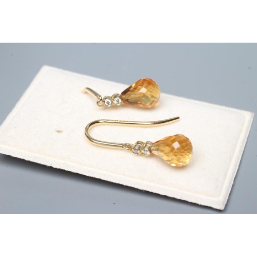 541 - A PAIR OF CITRINE DROP EARRINGS, the briolette cut stones peg set to two diamond points on 18ct gold... 