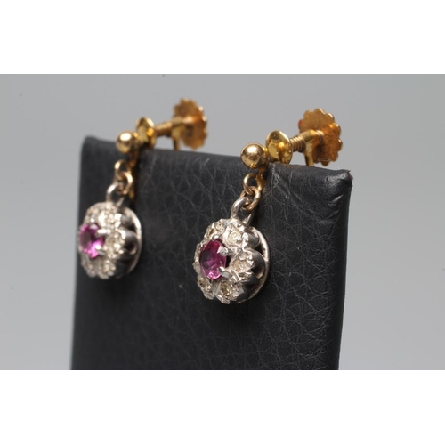 543 - A PAIR OF EDWARDIAN RUBY AND DIAMOND CLUSTER EARRINGS on screw back fittings stamped 9ct (Est. plus ... 