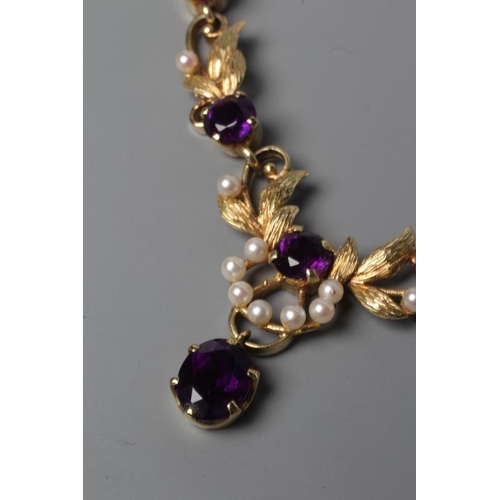 550 - AN AMETHYST NECKLACE, the seven circular facet cut stones claw set to leafy links with seed pearl mo... 