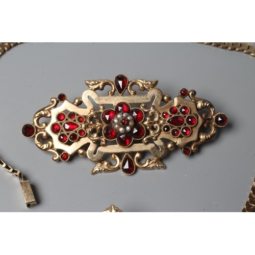 557 - A MID 19TH CENTURY GARNET AND SEED PEARL OPEN BROOCH similar to the previous lot, together with a si... 