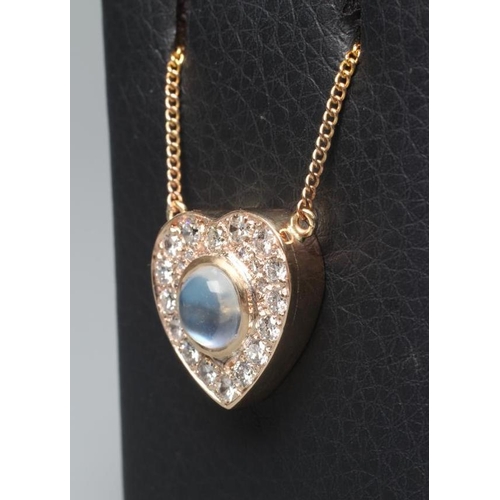 560 - A MOONSTONE AND DIAMOND CLUSTER HEART PENDANT, the central circular cabochon polished moonstone coll... 