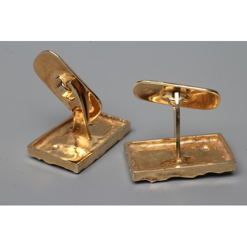 573 - A PAIR OF CUFFLINKS, stamped 585, of oblong form with abstract casting, each collet set with a small... 