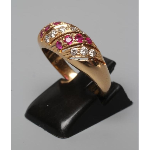 574 - A RUBY AND DIAMOND BAND RING set with alternating wrythen bands on a plain shank, stamped 18c, size ... 