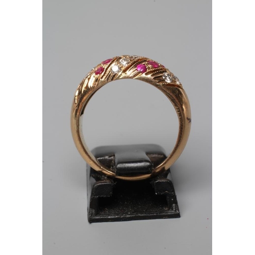 574 - A RUBY AND DIAMOND BAND RING set with alternating wrythen bands on a plain shank, stamped 18c, size ... 