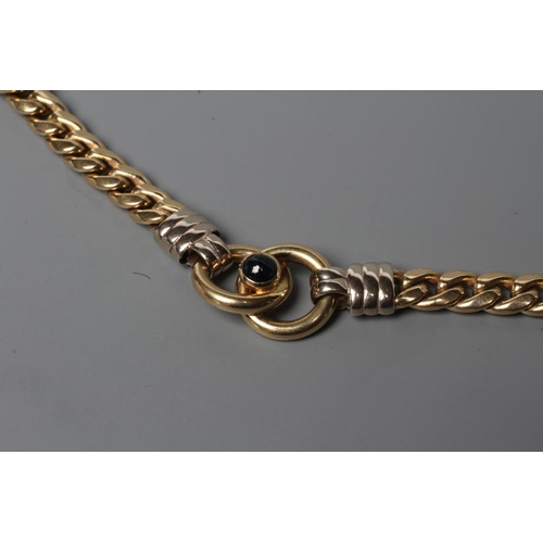 575 - A FLAT CURB LINK CHAIN NECKLACE, stamped 585, with three snaffle type link panels each centred by a ... 