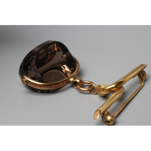 579 - A LATE VICTORIAN SWIVEL FOB, the facet cut topaz(?) engraved with initials, on a plain mount, stampe... 