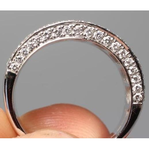 585 - A HALF HOOP DIAMOND COCKTAIL RING, the nine rows set with point set round brilliant cut stones total... 