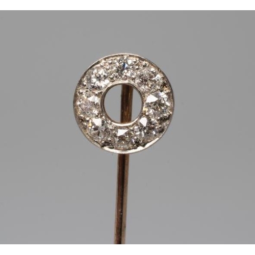 607 - A DIAMOND STICK PIN, the 