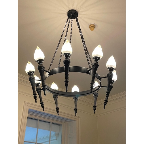 960 - AN EBONISED METAL TEN LIGHT CHANDELIER, 20th century, the circlet suspended from chains and issuing ... 