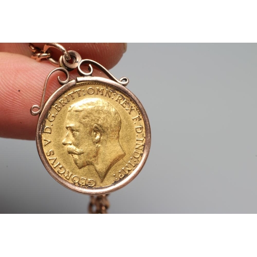 331 - A GEORGE V HALF SOVEREIGN, 1912, in a 9ct gold loose mount and pendant from a graduated curb link al... 