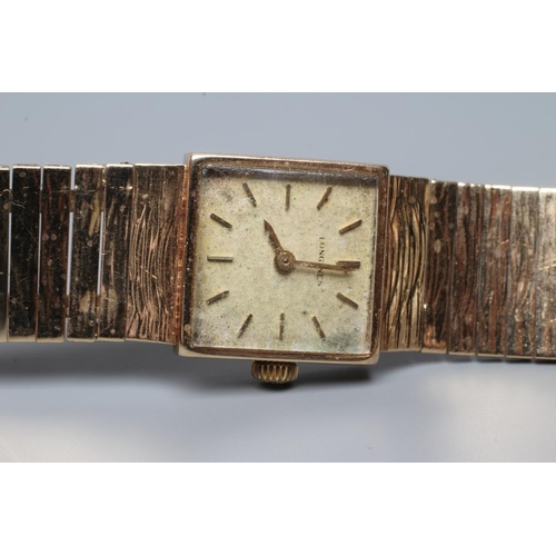 380 - A LADY'S 9CT GOLD LONGINES WRISTWATCH, the square champagne dial with applied gilt metal batons, the... 