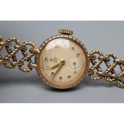 393 - A LADY'S 9CT GOLD TUDOR ROYAL WRISTWATCH, the champagne dial with gilt white Arabic numerals enclosi... 