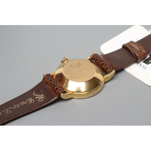 412 - A LADY'S 18CT GOLD BAUME & MERCIER WRISTWATCH, the brown grained plain dial with gilt metal hands an... 