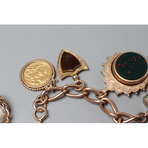 524 - A 9CT GOLD CHARM BRACELET hung with a loose mounted 1912 sovereign, a double sided pietra dura oblon... 