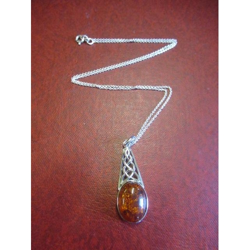 183 - CELTIC SILVER AND AMBER PENDANT ON SILVER CHAIN