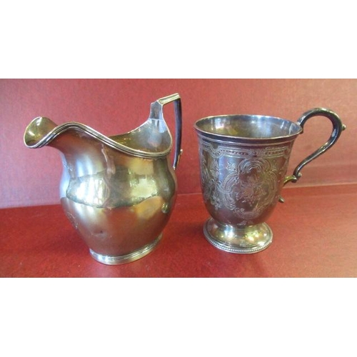 217 - SILVER GEORGIAN CREAM JUG AND A VICTORIAN MUG