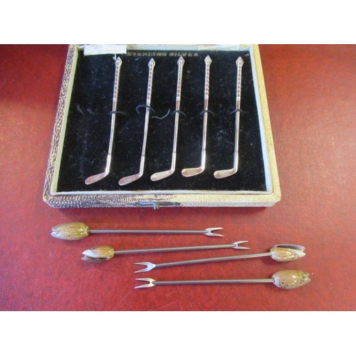 245 - FIVE CASED SILVER COCKTAIL STICKS AND FOUR OTHERS