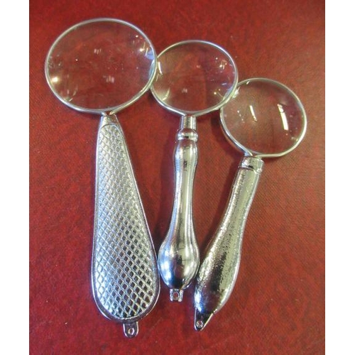 250 - THREE SMALL MAGNIFYING GLASSES