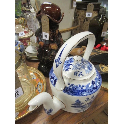 91 - BLUE AND WHITE WILLOW PATTERN TEAPOT AND TREACLE GLAZED TOBY JUG