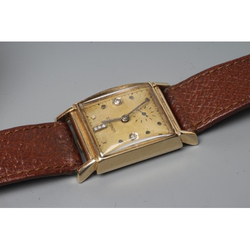 386 - A GENTLEMAN'S LONGINES WRISTWATCH, the oblong dark champagne dial with three small channel set diamo... 