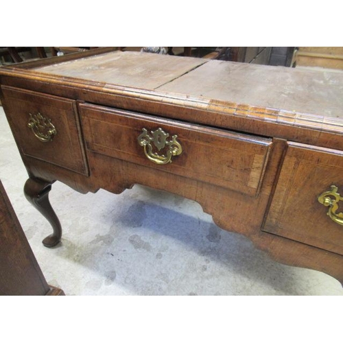 921 - A GEORGIAN WALNUT CHEST ON STAND, mid 18th century, crossbanded with feather stringing, the cavetto ... 