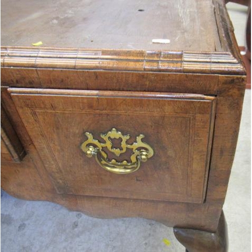 921 - A GEORGIAN WALNUT CHEST ON STAND, mid 18th century, crossbanded with feather stringing, the cavetto ... 