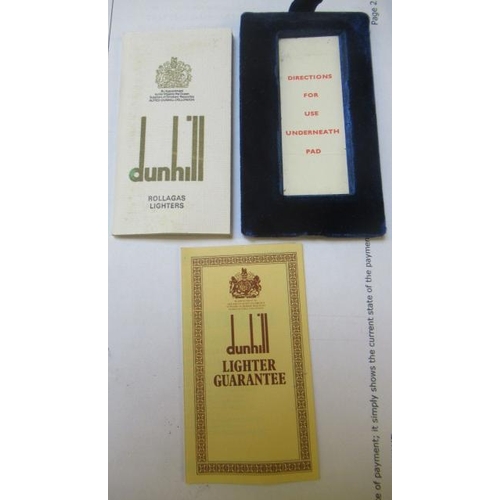 152 - A DUNHILL 9CT GOLD ROLLAGAS CIGARETTE LIGHTER of plain oblong form with engine turning, 2 1/2