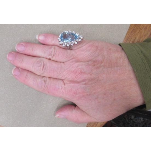 535 - AN AQUAMARINE AND DIAMOND COCKTAIL RING, the pear cut aquamarine of approximately 12.50cts, claw set... 