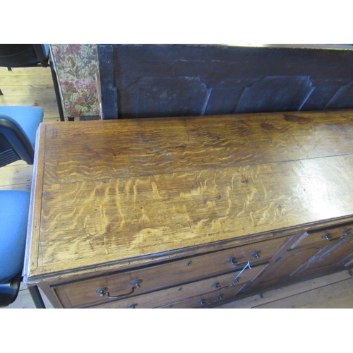 936 - A GEORGIAN OAK AND MAHOGANY BANDED ENCLOSED DRESSER, late 18th century, the moulded edged top over c... 