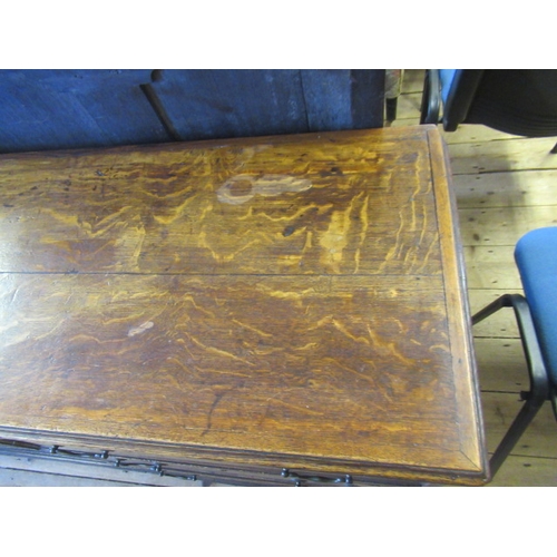 936 - A GEORGIAN OAK AND MAHOGANY BANDED ENCLOSED DRESSER, late 18th century, the moulded edged top over c... 