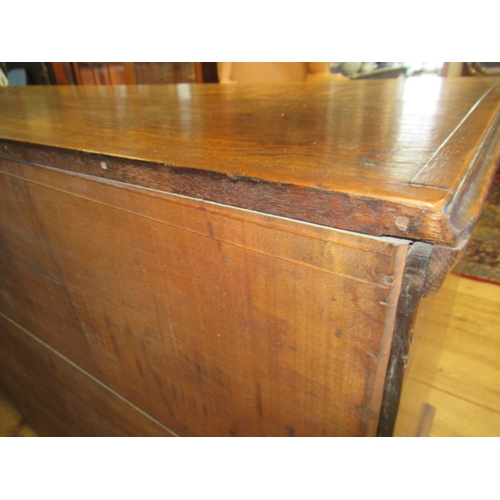 936 - A GEORGIAN OAK AND MAHOGANY BANDED ENCLOSED DRESSER, late 18th century, the moulded edged top over c... 