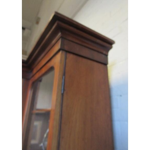 926 - A VICTORIAN MAHOGANY BREAKFRONT LIBRARY BOOKCASE, the moulded cornice over four arched glazed doors,... 