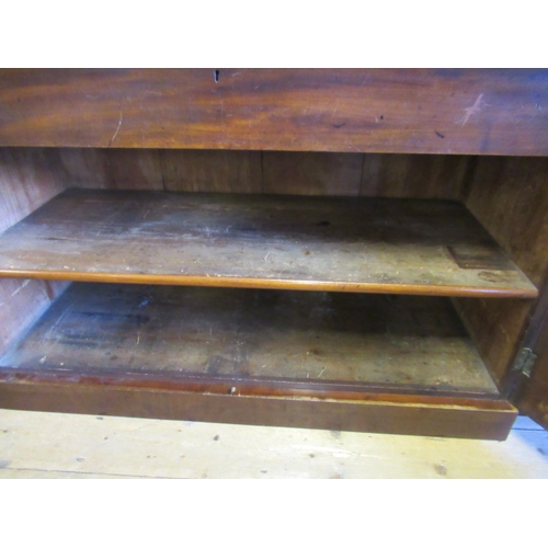 926 - A VICTORIAN MAHOGANY BREAKFRONT LIBRARY BOOKCASE, the moulded cornice over four arched glazed doors,... 