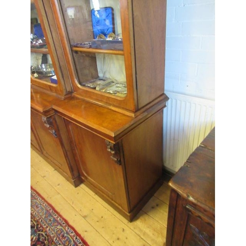 926 - A VICTORIAN MAHOGANY BREAKFRONT LIBRARY BOOKCASE, the moulded cornice over four arched glazed doors,... 