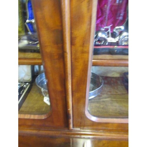 926 - A VICTORIAN MAHOGANY BREAKFRONT LIBRARY BOOKCASE, the moulded cornice over four arched glazed doors,... 