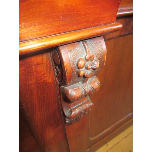 926 - A VICTORIAN MAHOGANY BREAKFRONT LIBRARY BOOKCASE, the moulded cornice over four arched glazed doors,... 