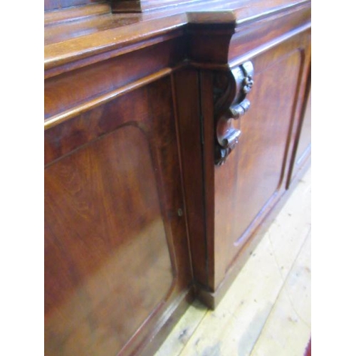 926 - A VICTORIAN MAHOGANY BREAKFRONT LIBRARY BOOKCASE, the moulded cornice over four arched glazed doors,... 