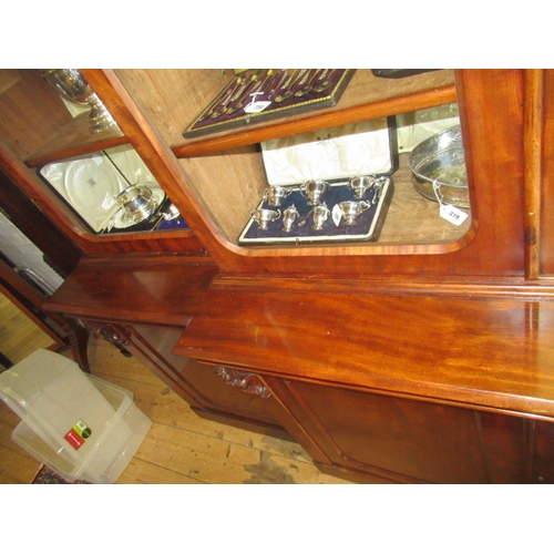 926 - A VICTORIAN MAHOGANY BREAKFRONT LIBRARY BOOKCASE, the moulded cornice over four arched glazed doors,... 