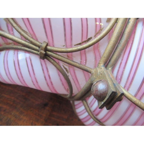 666 - A VICTORIAN HANGING LANTERN, the wirework frame with a custom blown pink and white candy stripe shad... 