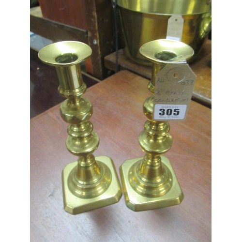 305 - TWO BRASS CANDLESTICKS