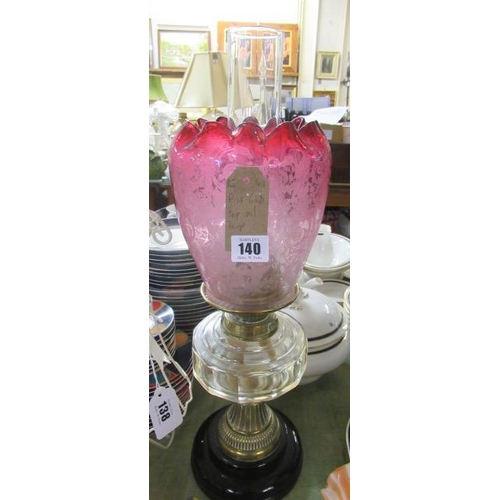 140 - OIL LAMP WITH PINK GLASS SHADE